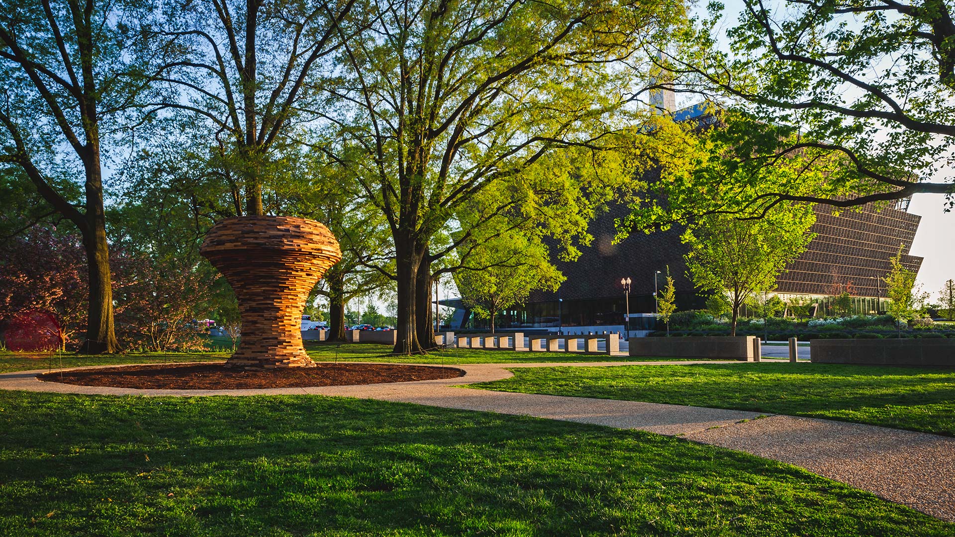 Large, outdoor wooden sculpture by UMD professor of Art Foon Sham, in the Smithsonian Gardens
