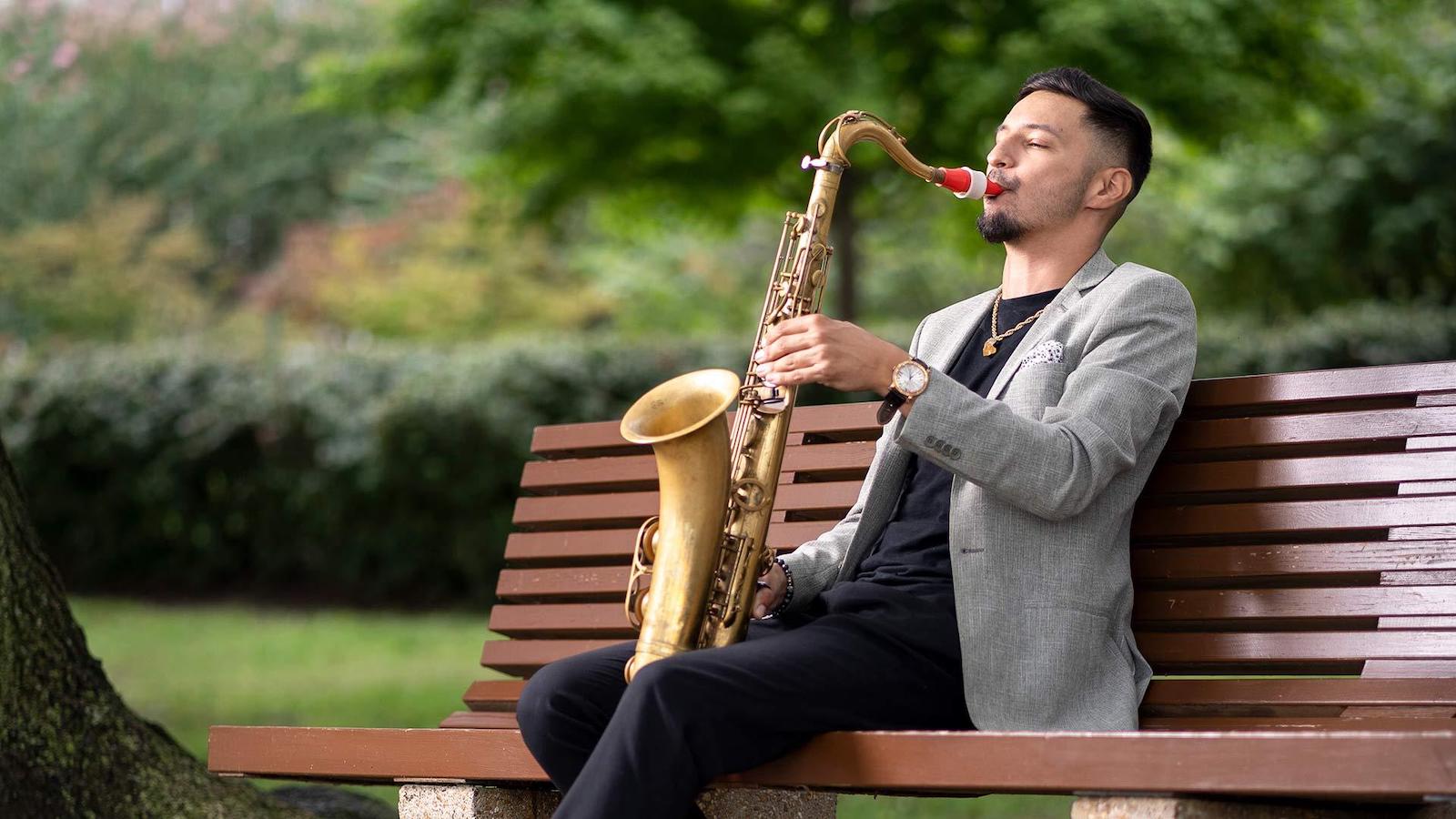 Elijah Balbed playing the saxophone